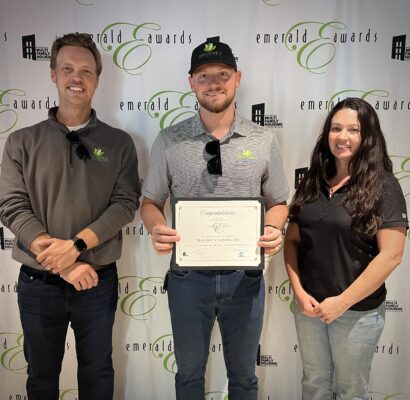 The Malone's team accepting the WMFHA Emerald Award Nomination award